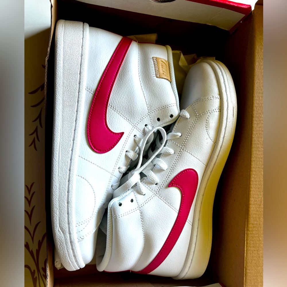 Nike white high tops with pink swoop
